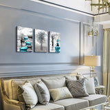 modern abstract canvas wall art featuring serene blue and black designs on a stylish living room wall.