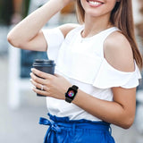 Smiling woman wearing a durable sport band for Apple Watch while holding a coffee cup.