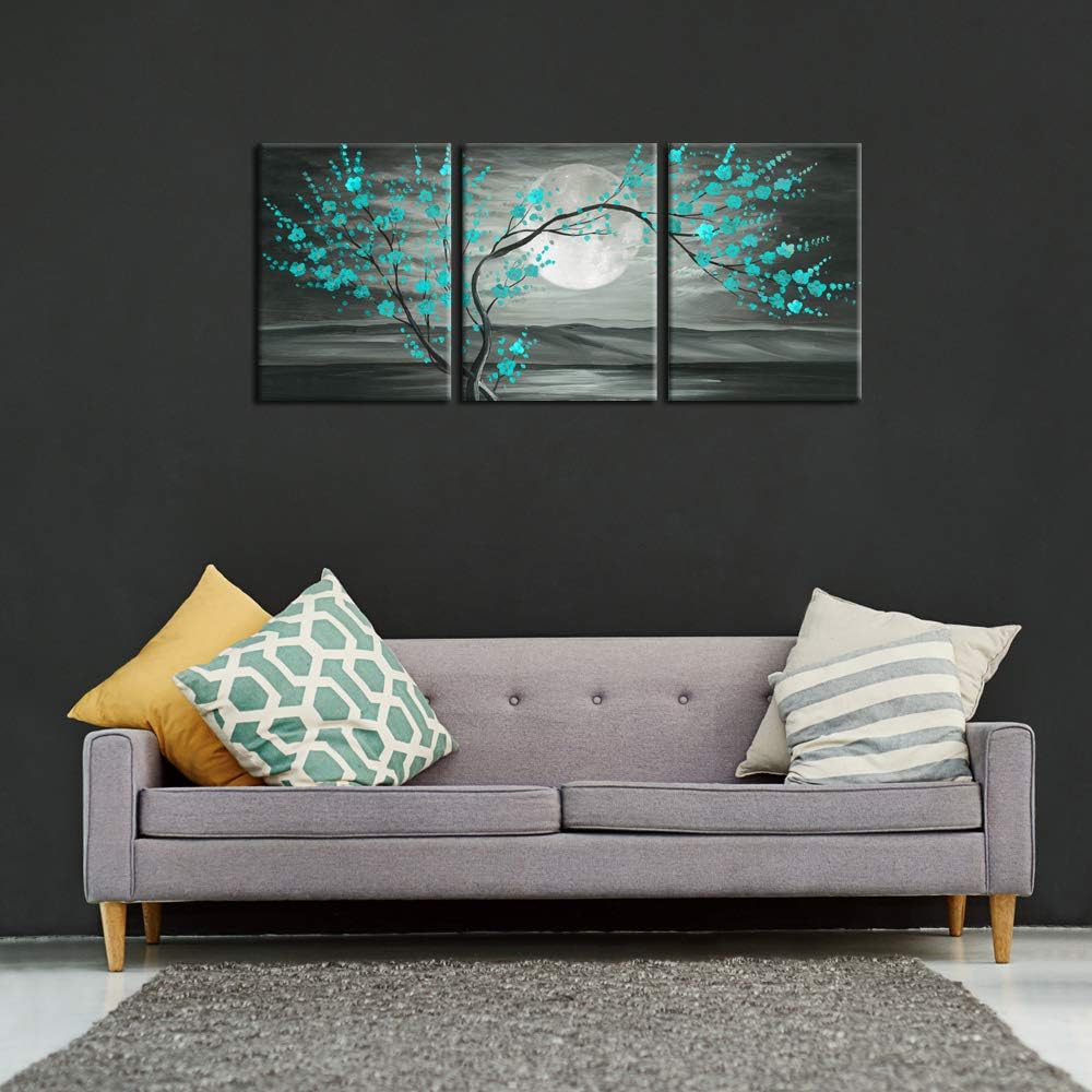 Teal plum blossom wall art displayed as a 12x16" framed canvas set above a modern couch.