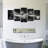 Black and white lightning wall art depicting a stormy city night view in a modern bathroom setting.