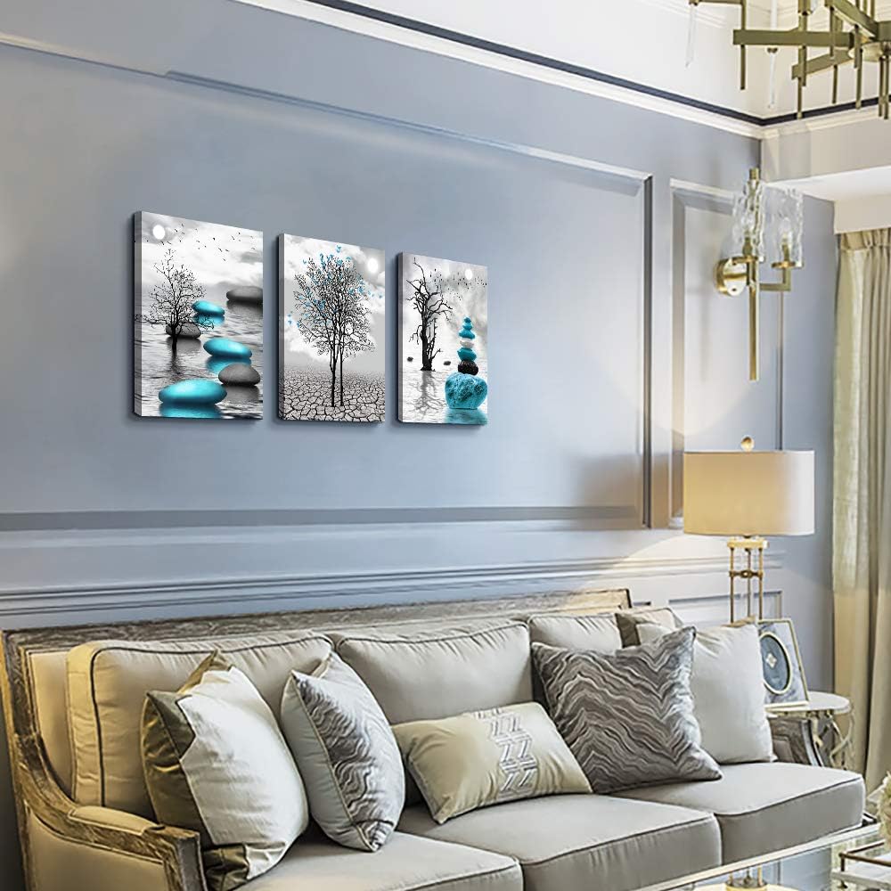 modern abstract canvas wall art featuring serene blue and black designs on a stylish living room wall.