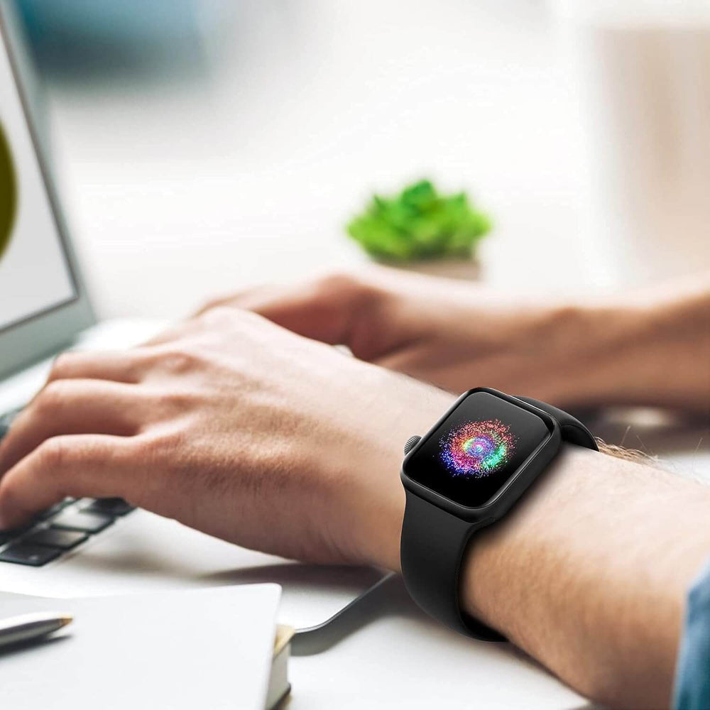 durable sport band for Apple Watch worn on wrist while typing on laptop in a bright workspace.