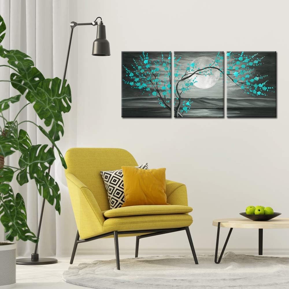 Teal plum blossom wall art 12x16" framed canvas set displayed in a modern living room with yellow chair and lamp.