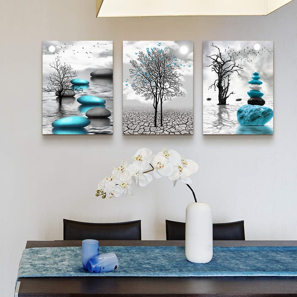 Modern abstract canvas wall art featuring blue and black elements in a serene setting.