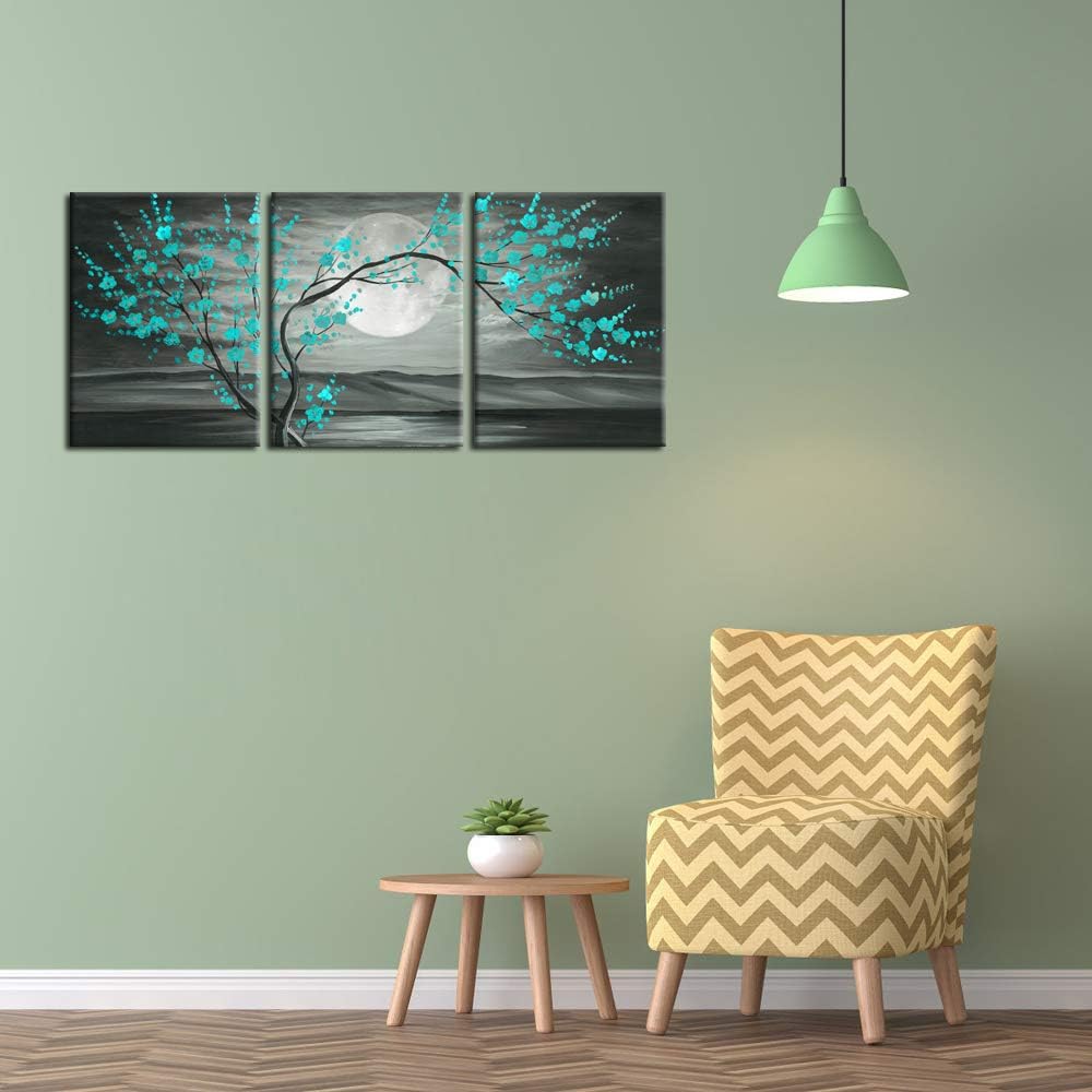 Teal plum blossom wall art 12x16" framed canvas set displayed in modern living room with green walls.
