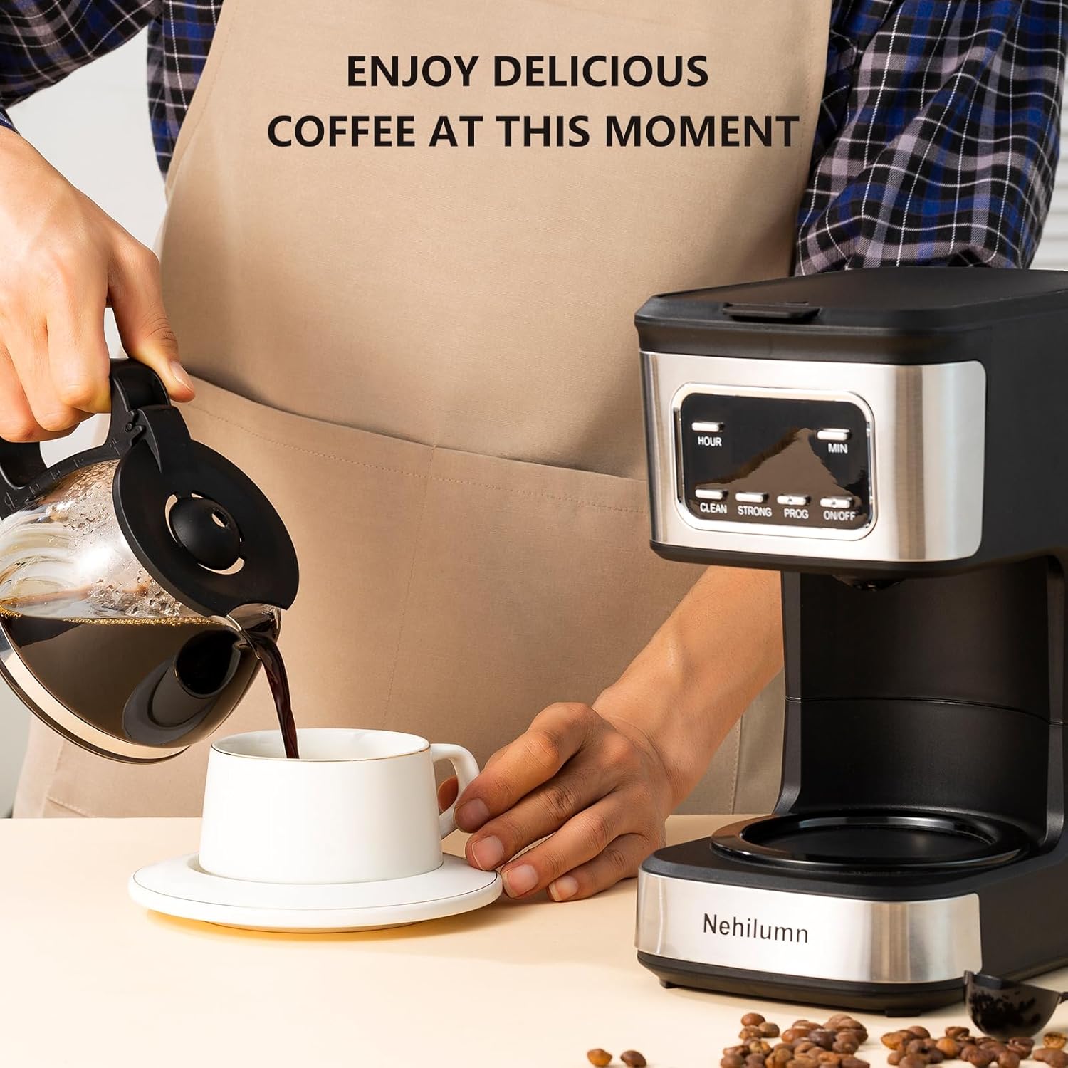 Programmable coffee maker with reusable filter brewing a fresh cup of coffee.