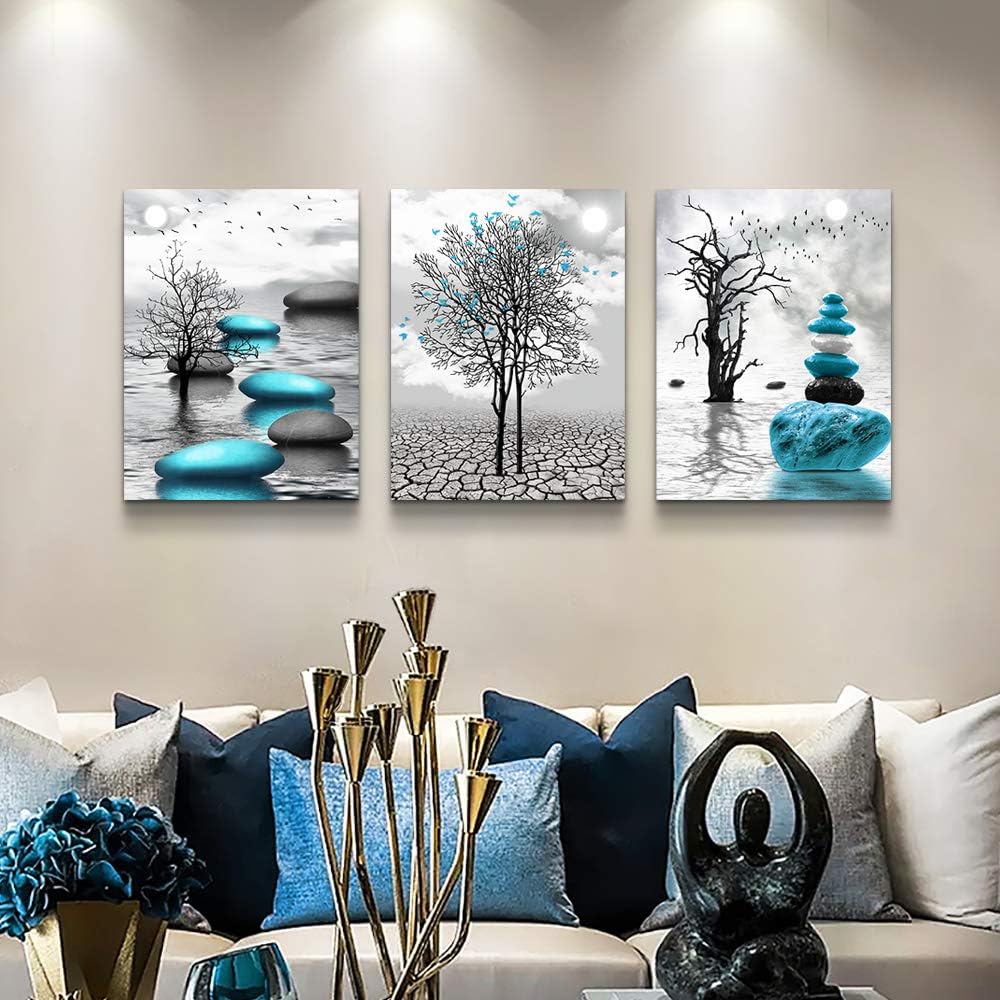 modern abstract canvas wall art featuring serene landscapes and blue accents in a stylish living room setting.