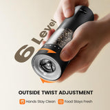 Hand adjusting the 6-level twist of an electric salt and pepper grinder set | Rechargeable Automatic for easy seasoning.