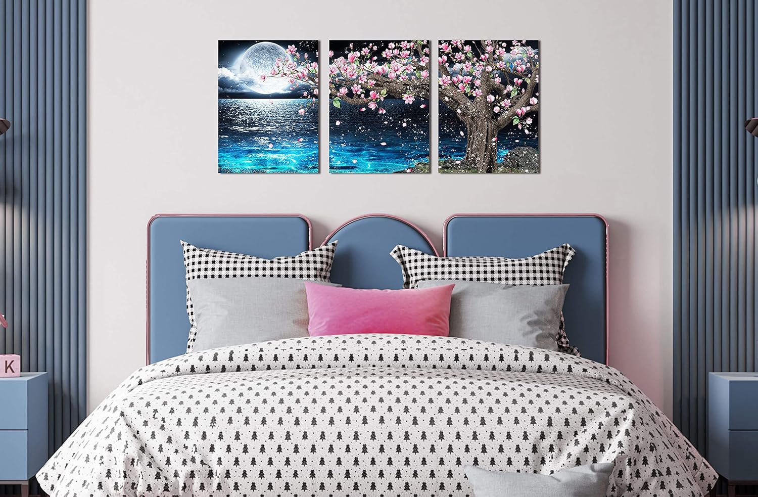 3 piece canvas wall art set featuring a pink tree and moon decor above a cozy bed in a modern bedroom.