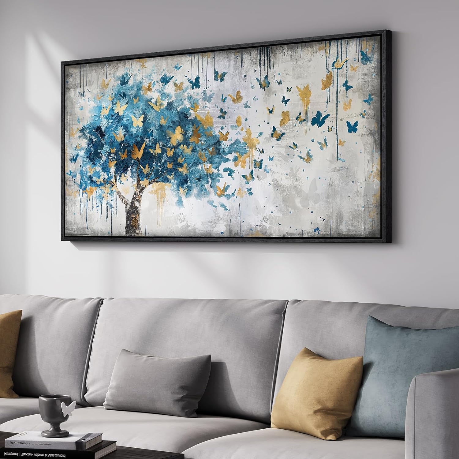 Large gold tree of life wall art featuring colorful butterflies on a framed canvas print.