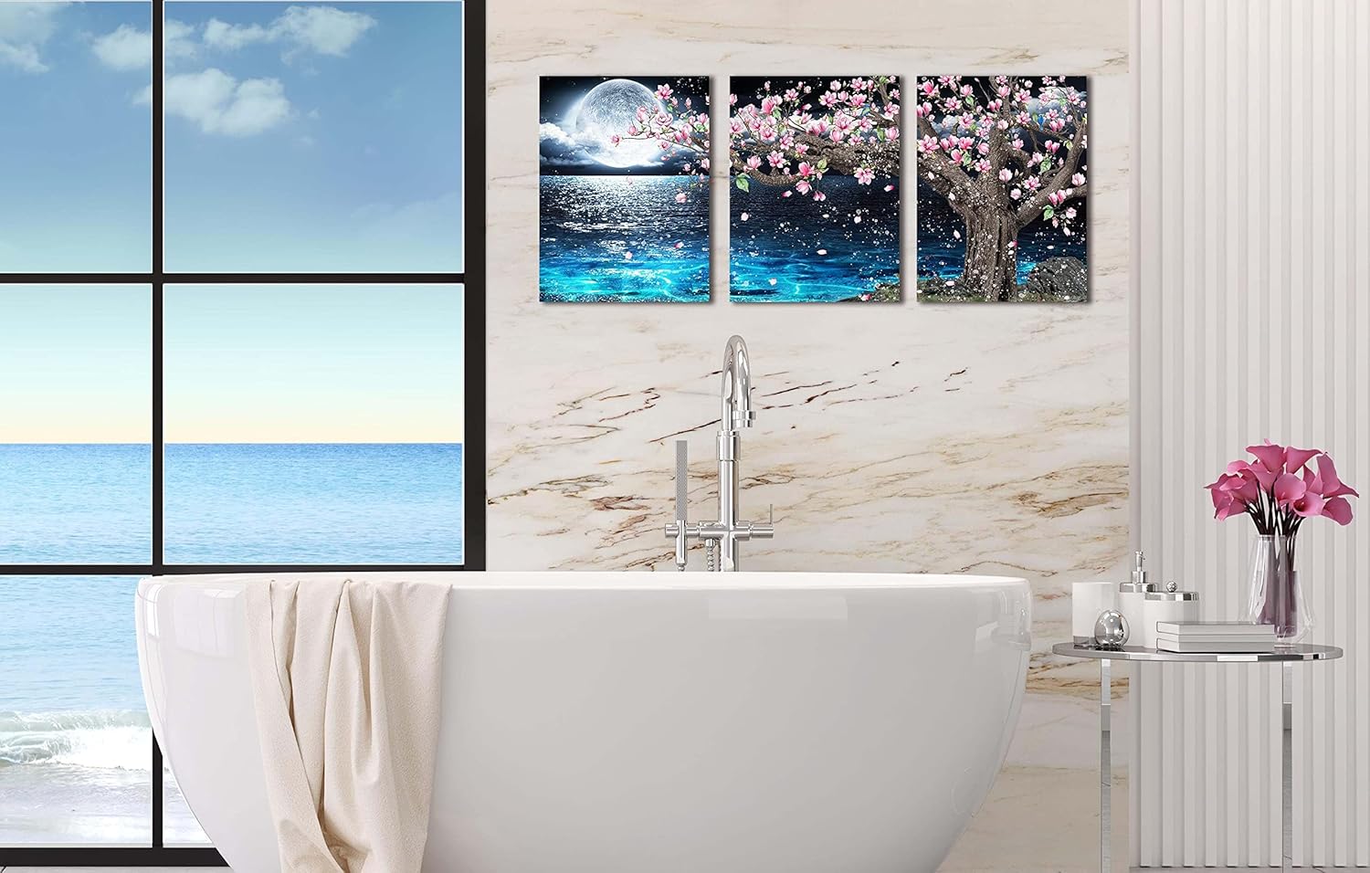 3 piece canvas wall art set featuring a pink tree and moon decor above a stylish bathtub with ocean view.