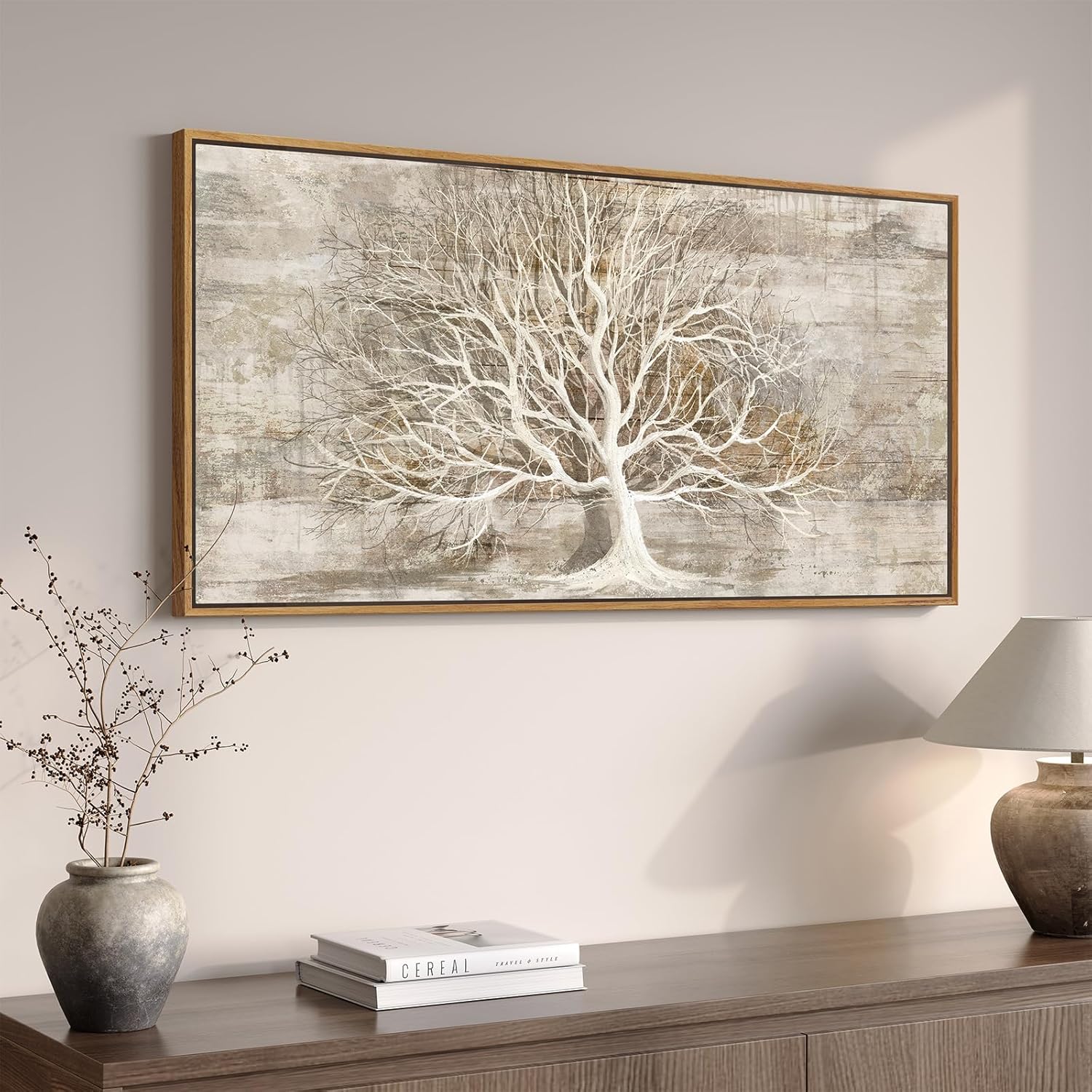 Large gold tree of life wall art displayed in a modern living room on a neutral wall.
