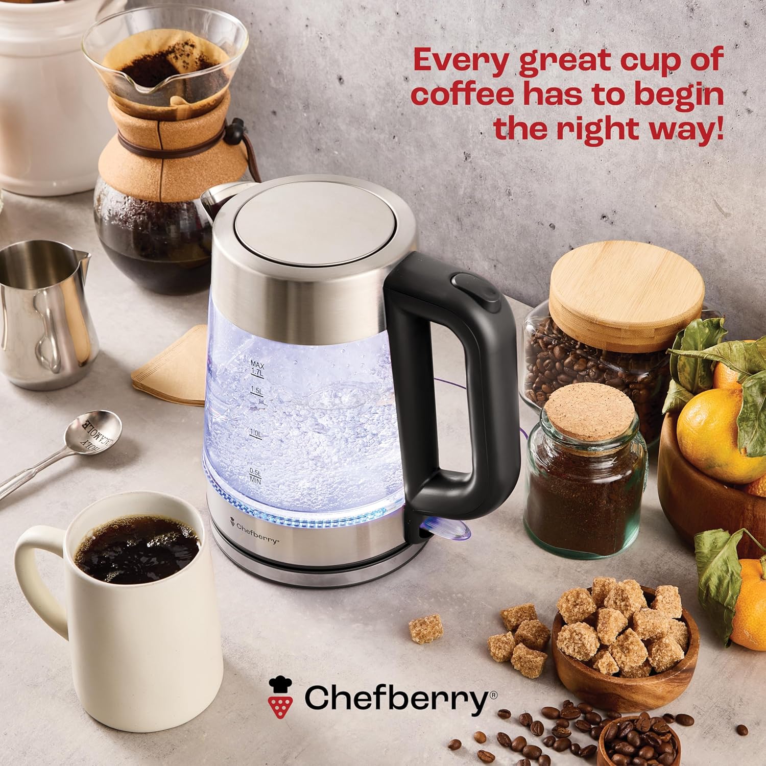 glass electric kettle BPA-free beside coffee ingredients and a cup of coffee.