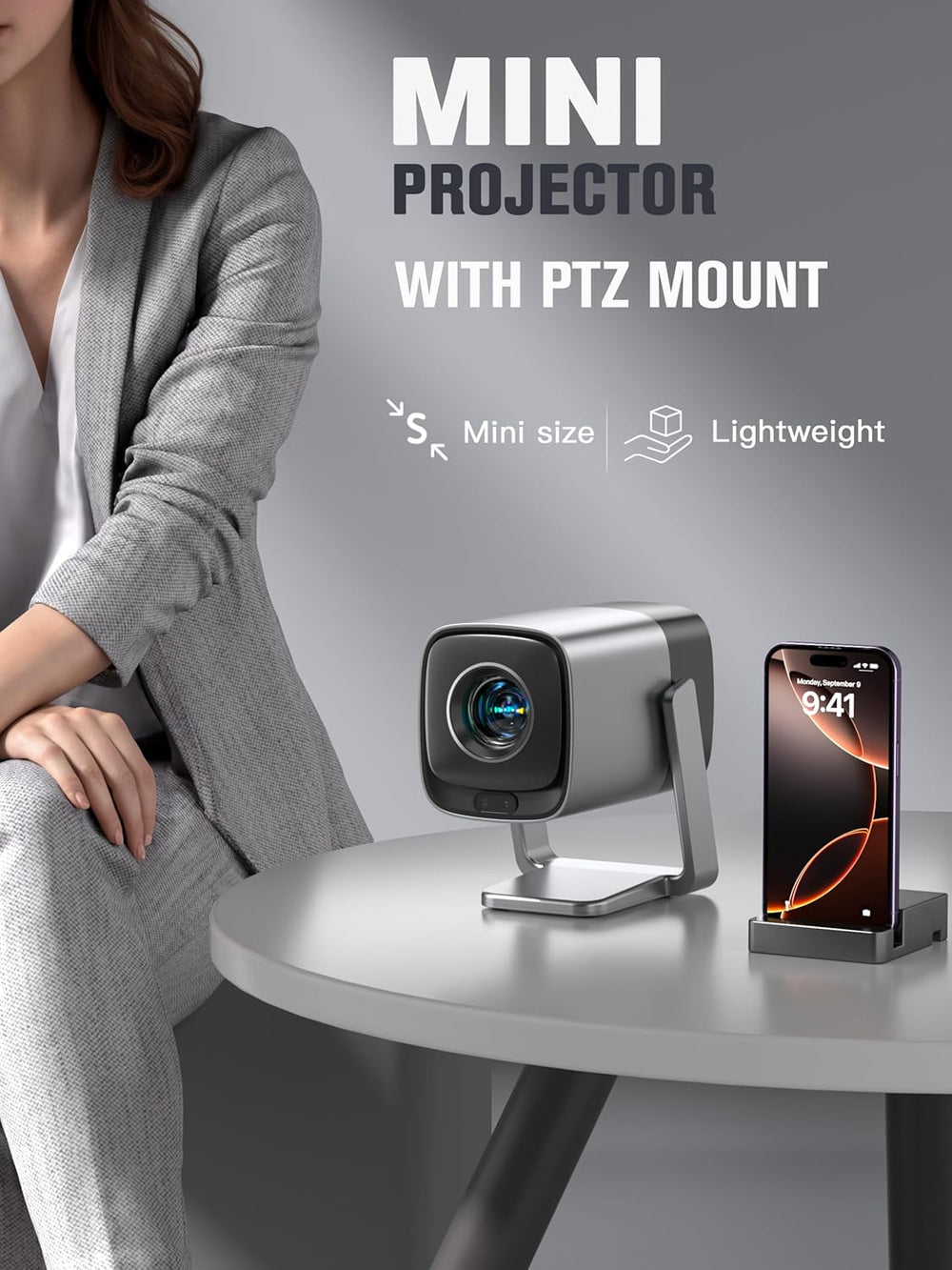 smart projector with Netflix and 4K support on a table next to smartphone, showcasing mini size and lightweight design.